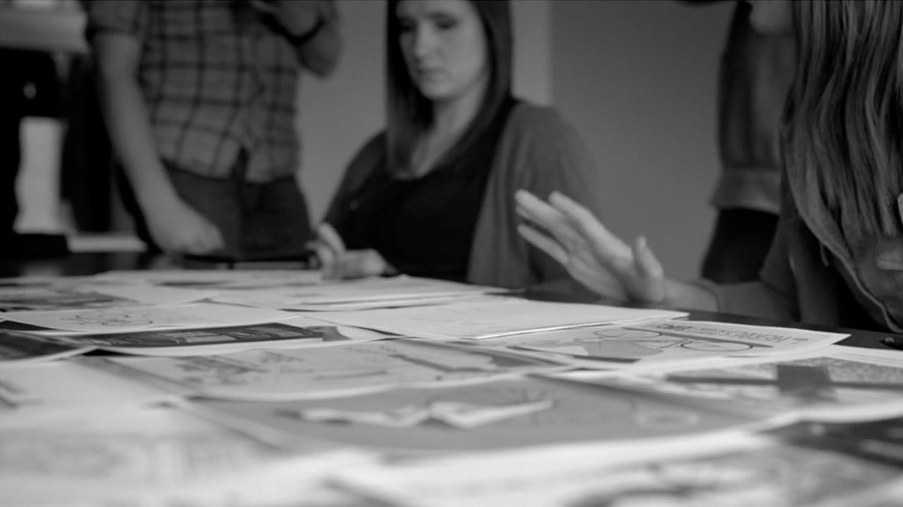 Creatives at Atomicdust discussing projects