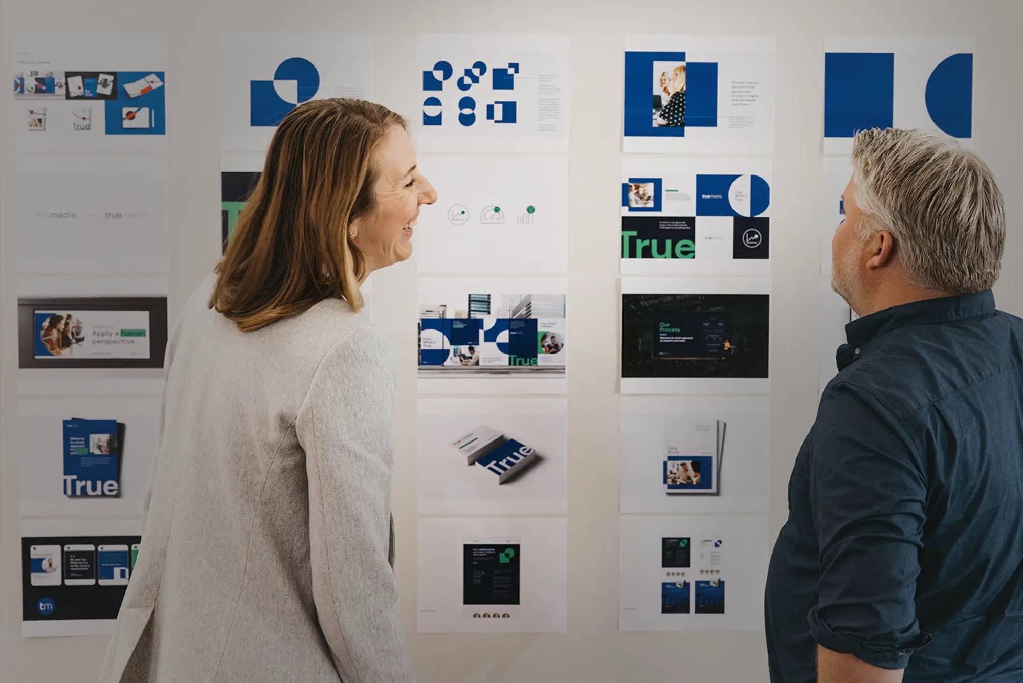 Atomicdust team members discuss a project in the office